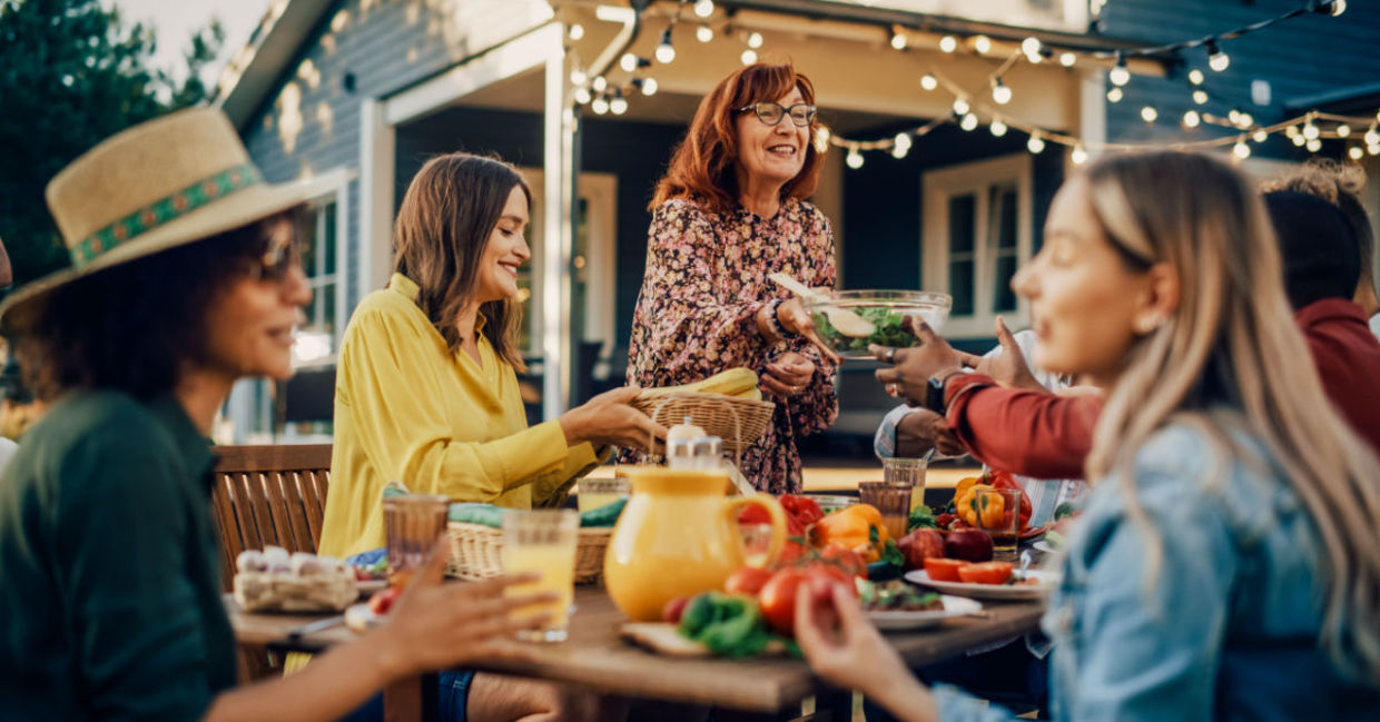 Family laughing and talking together at family gathering Family laughing and talking together at family gathering
