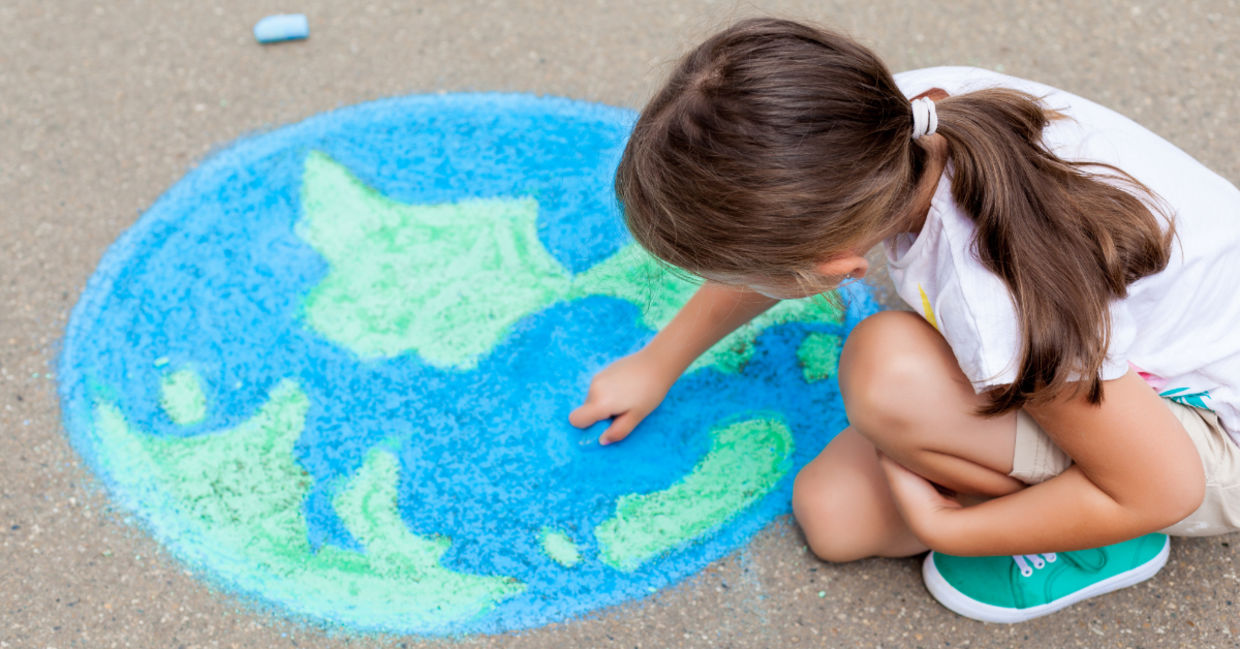 A girl drawing the earth. A girl drawing the earth.