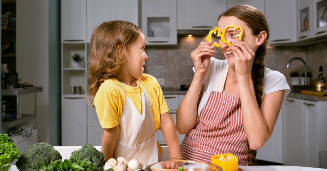 A mother and daughter have fun preparing vegetables, an important food in a psychobiotic diet. A mother and daughter have fun preparing vegetables, an important food in a psychobiotic diet.