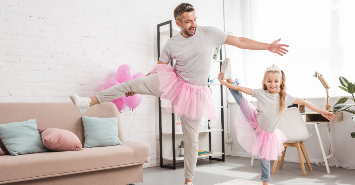 Father and daughter in pink tutu skirts. Father and daughter in pink tutu skirts.