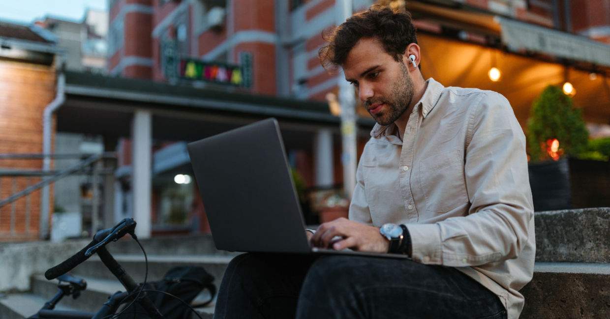A young man typing on a computer. A young man typing on a computer.