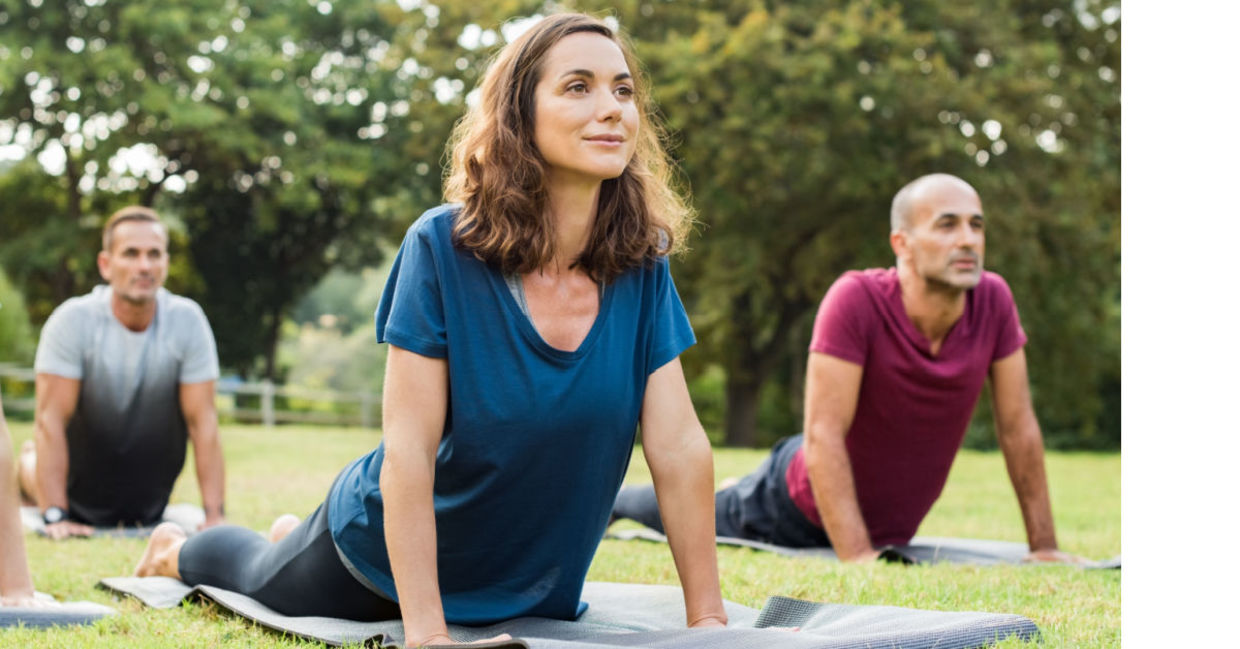 Yoga stretching in a park, Yoga stretching in a park,