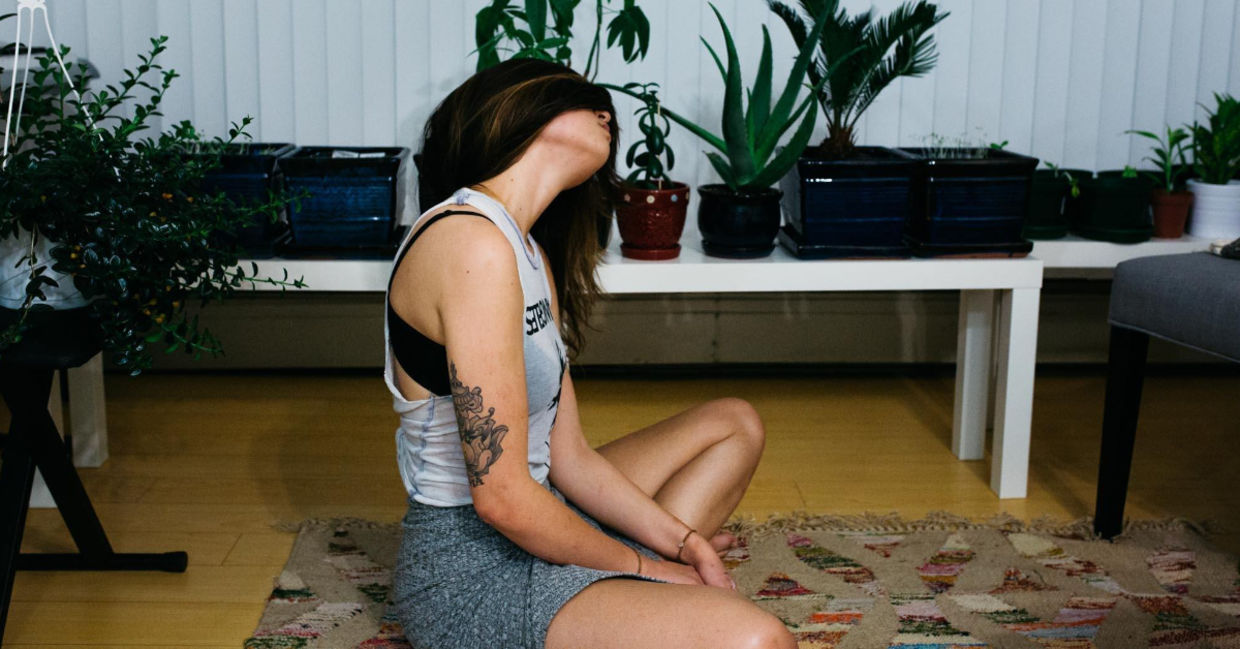 Woman stretching her neck. Woman stretching her neck.