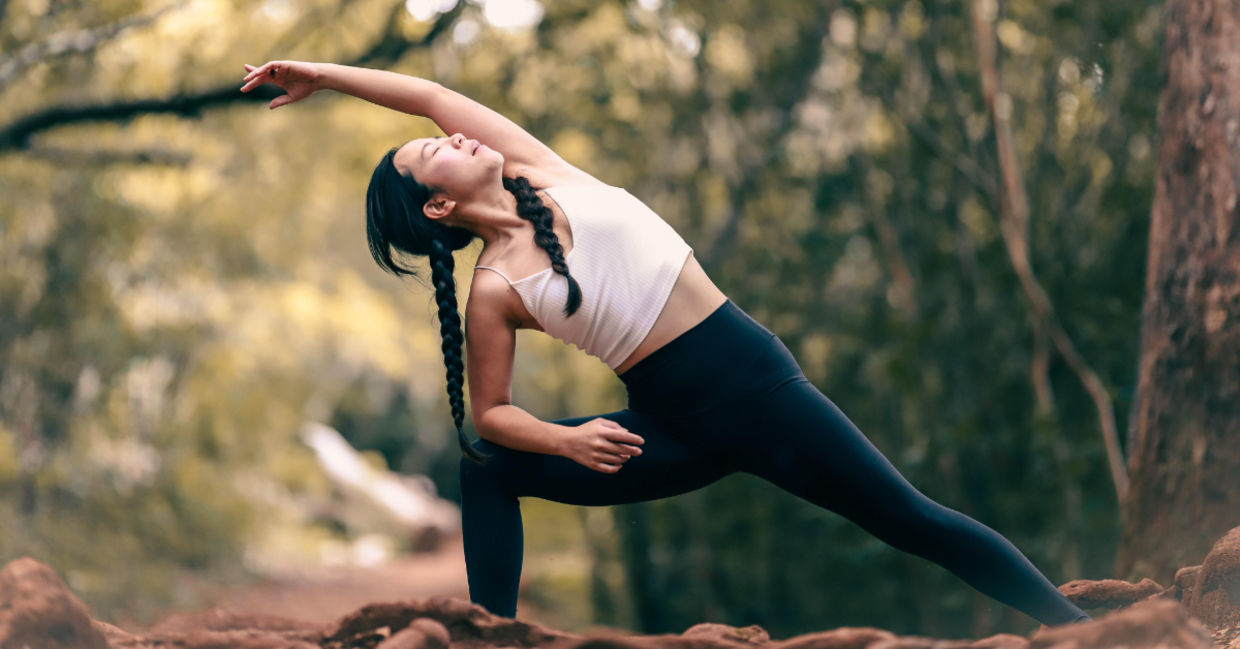 Woman in the extended side angle yoga pose. Woman in the extended side angle yoga pose.