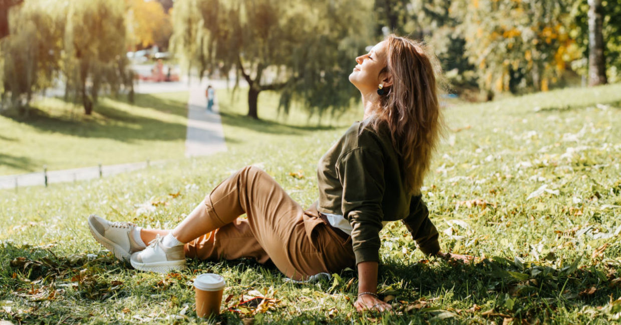 Woman relaxing in nature during her lunch break. Woman relaxing in nature during her lunch break.