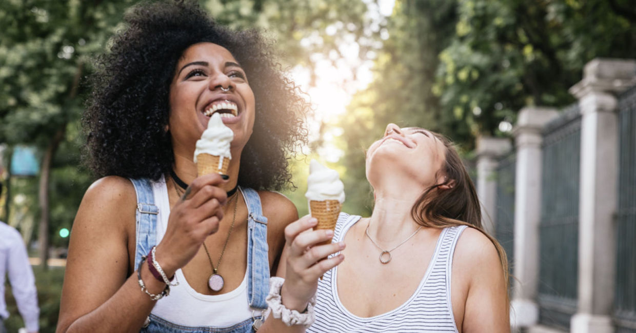 Two friends enjoying ice cream. Two friends enjoying ice cream.