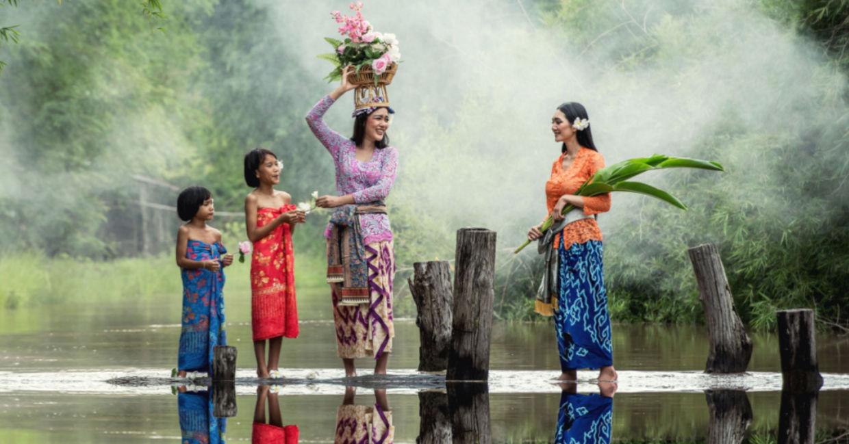 Balinese women preparing a traditional offering. Balinese women preparing a traditional offering.