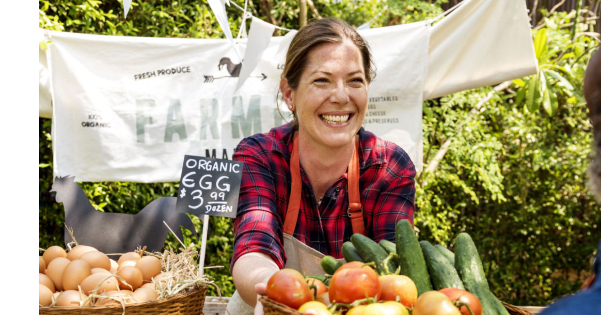 Women selling produce at a famers market. Women selling produce at a famers market.