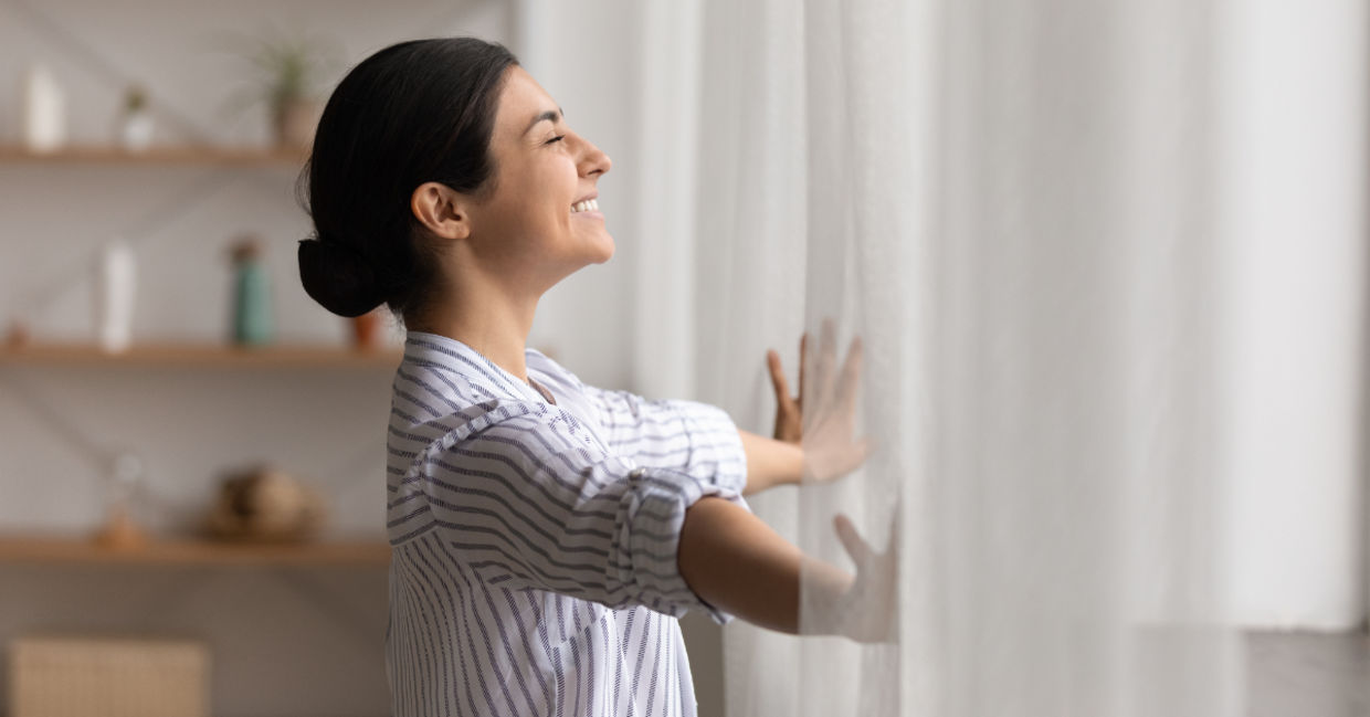 Opening drapes to let the sunlight in. Opening drapes to let the sunlight in.