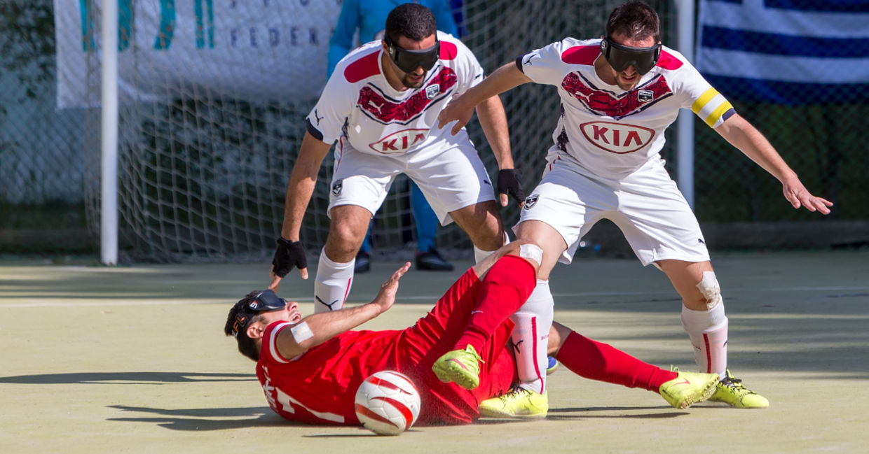 Playing blind soccer. Playing blind soccer.