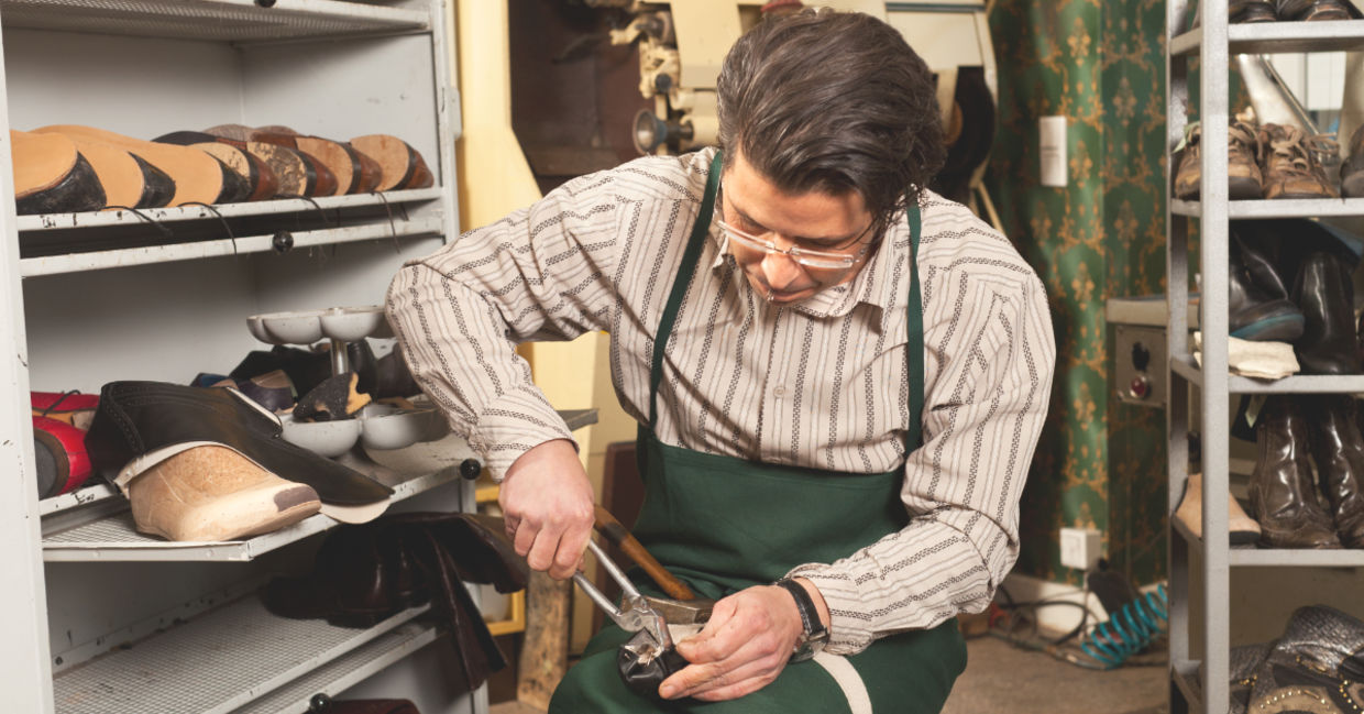 Shoemaker at work.