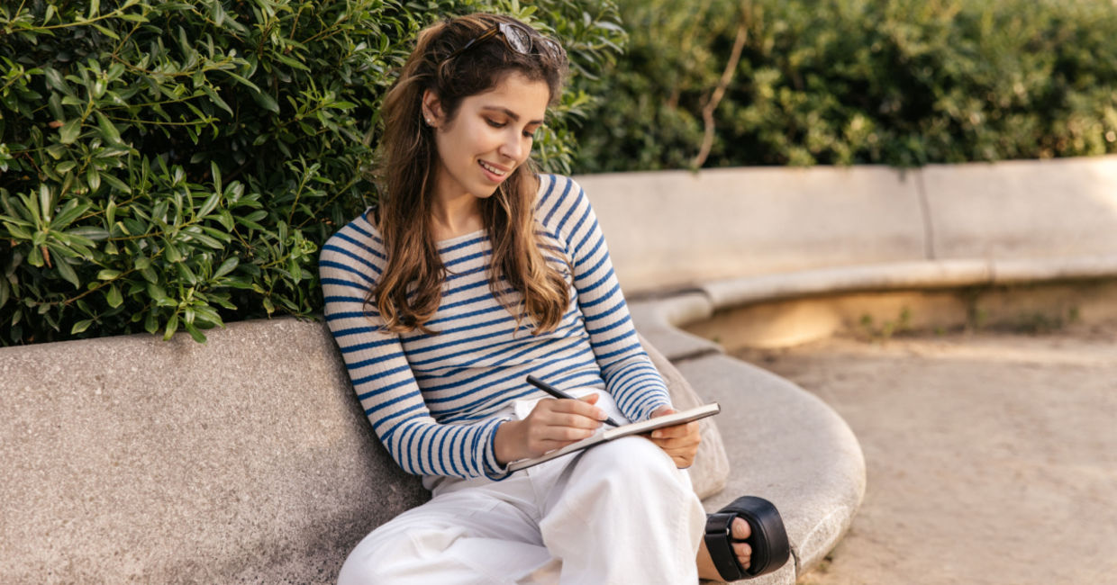 Woman writing down her thoughts. Woman writing down her thoughts.