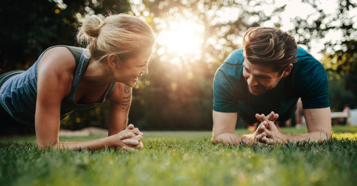 Couple exercising in their backyard. Couple exercising in their backyard.