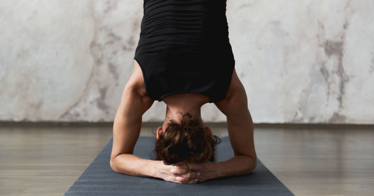 Woman in the headstand yoga pose. Woman in the headstand yoga pose.