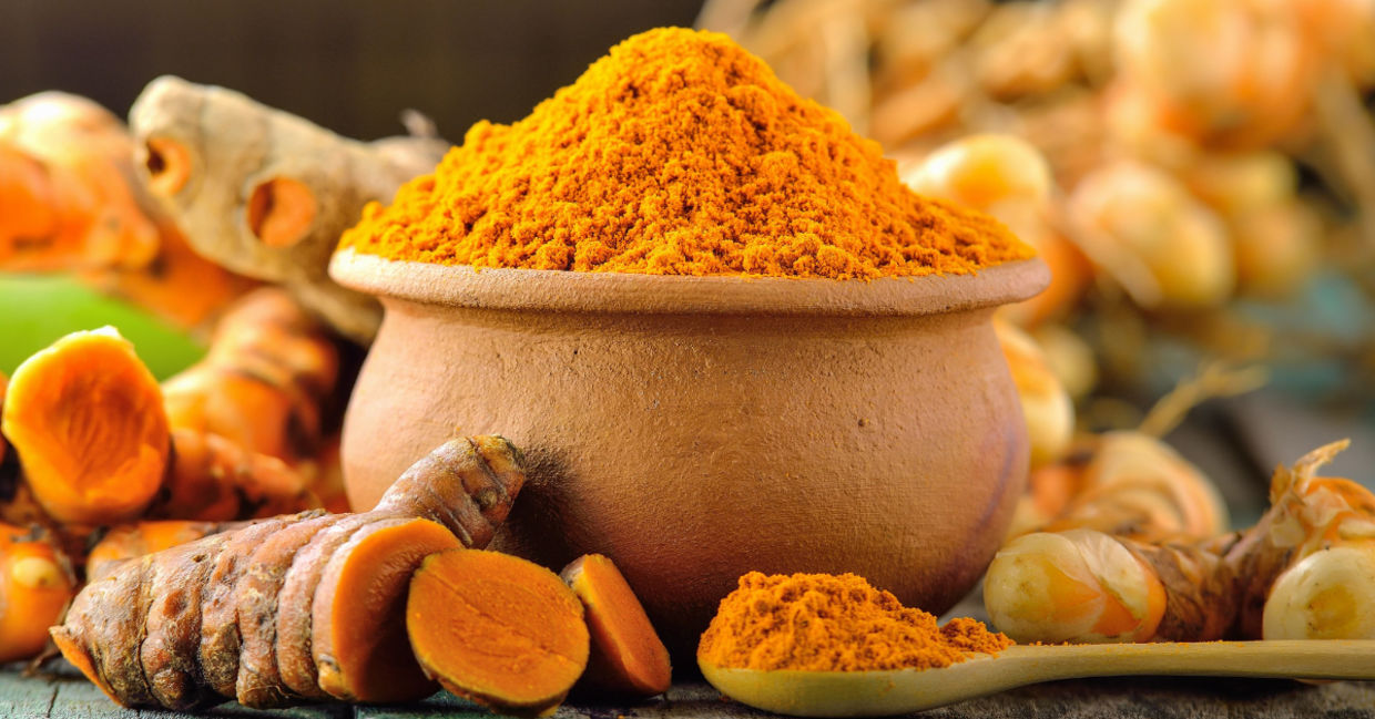 Healthy turmeric roots and ground spice. Healthy turmeric roots and ground spice.