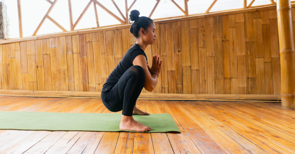 Women in the malasana yoga pose. Women in the malasana yoga pose.
