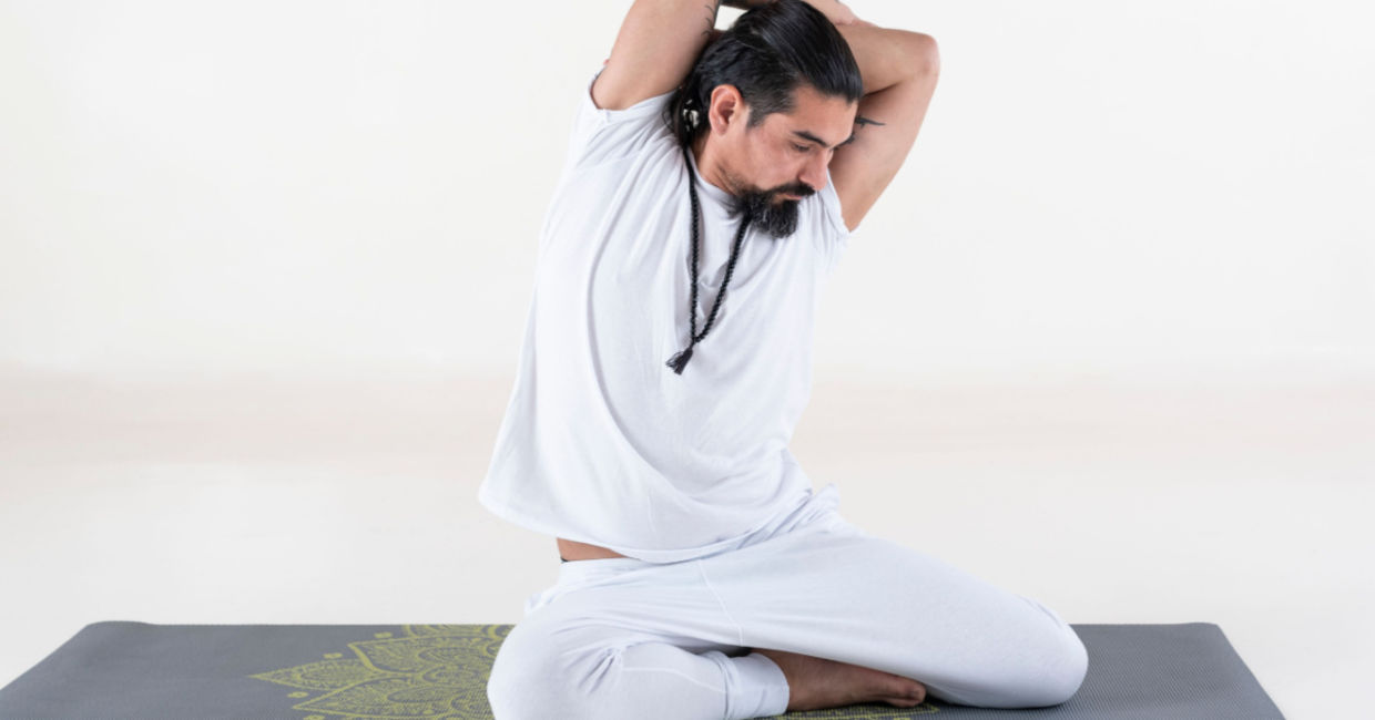 Entering the bharadvaja's twist yoga pose. Entering the bharadvaja's twist yoga pose.