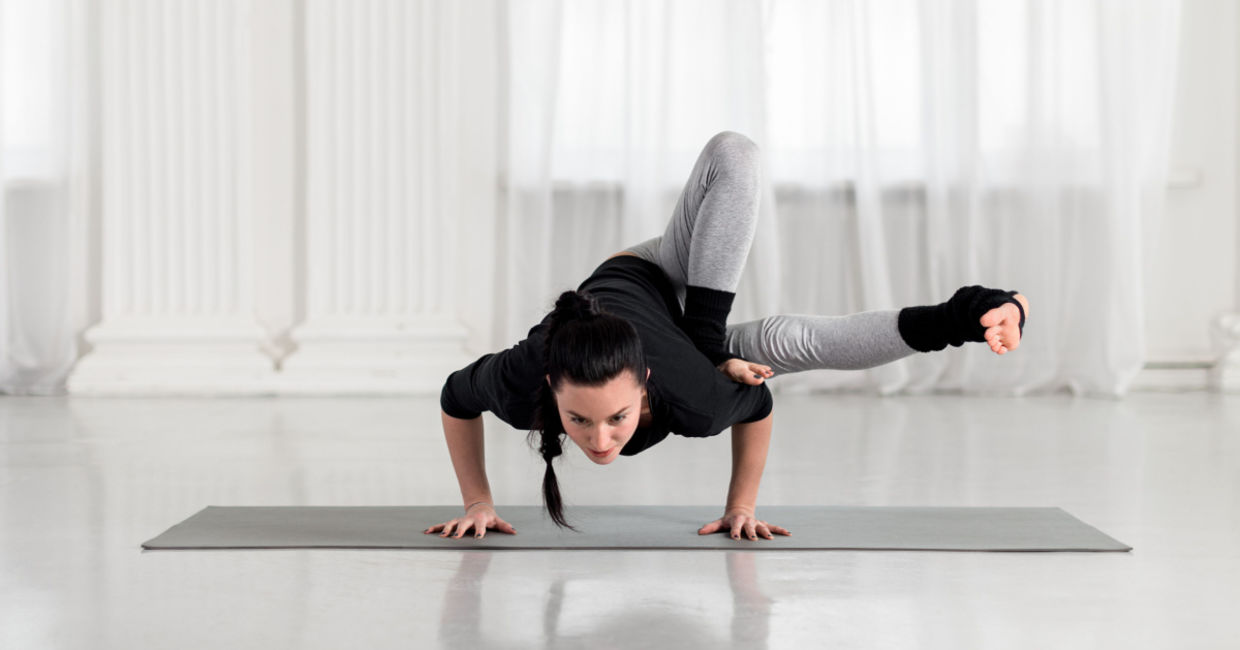 Practicing the dragonfly yoga pose. Practicing the dragonfly yoga pose.