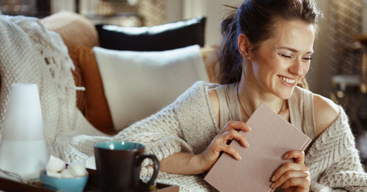 a woman embracing hygge. a woman embracing hygge.