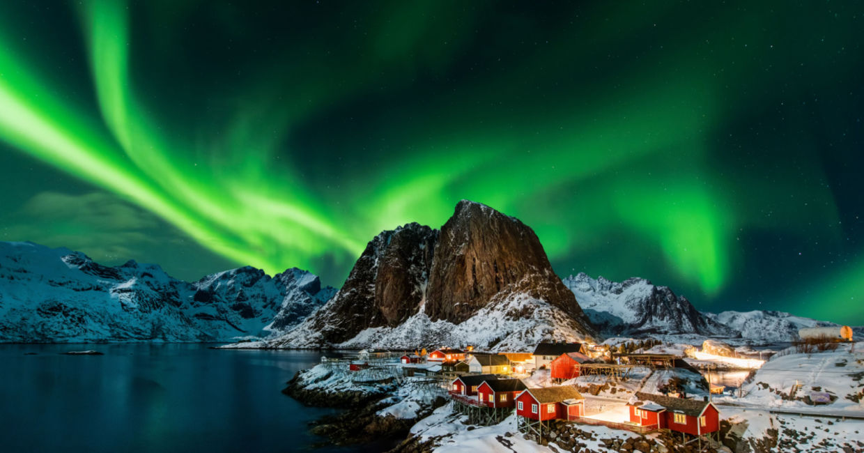 Aurora borealis over Hamnoy in Norway . Aurora borealis over Hamnoy in Norway .