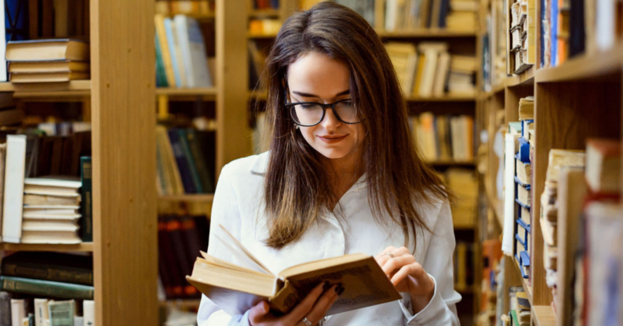 A woman looking words up in a dictionary. A woman looking words up in a dictionary.
