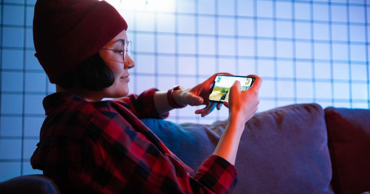 Playing game on a cellphone. Playing game on a cellphone.