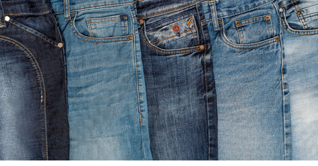 Multiple pairs of blue jeans. Multiple pairs of blue jeans.