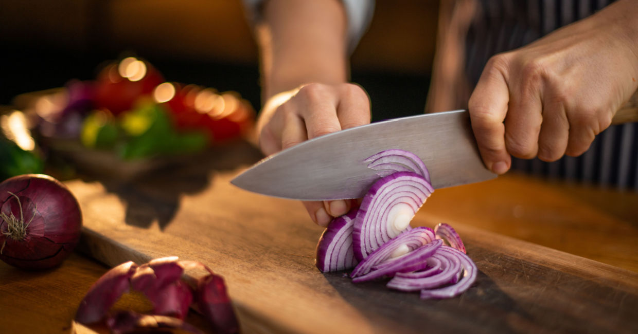 Chef cutting red onions. Chef cutting red onions.