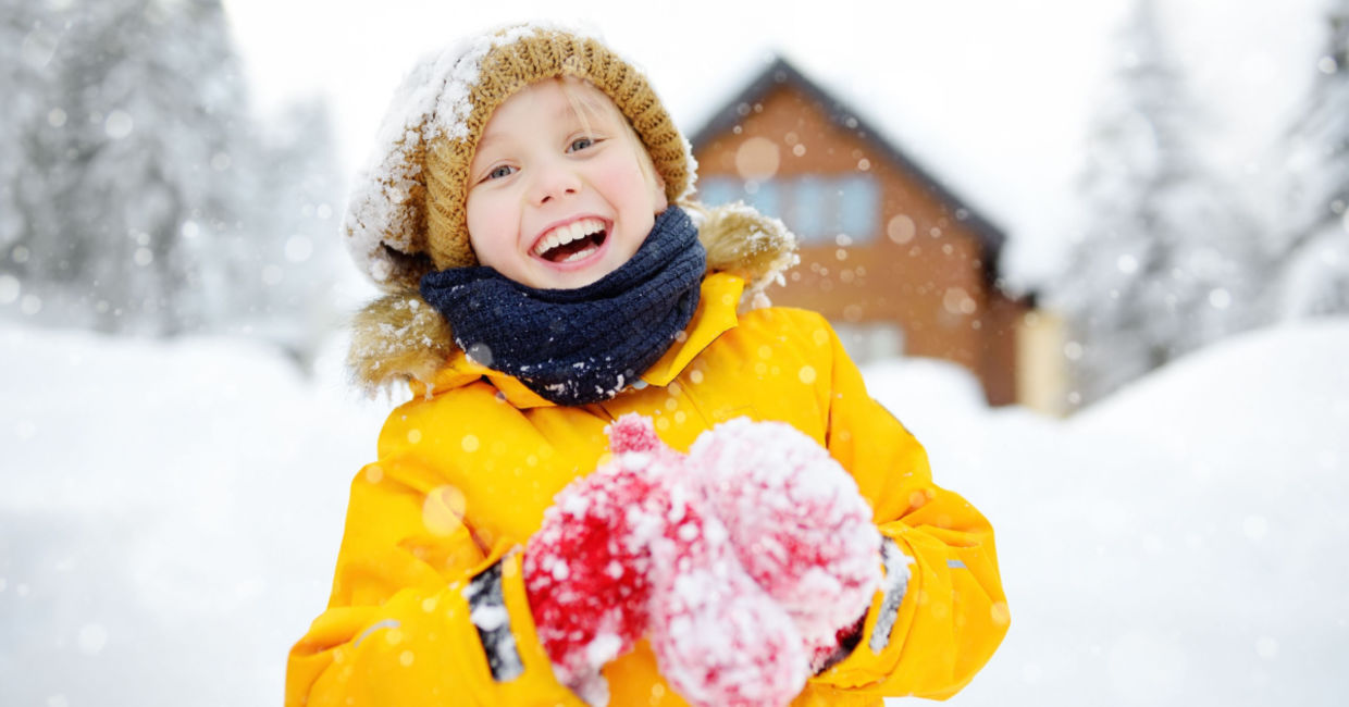 Child playing outside during the winter. Child playing outside during the winter.