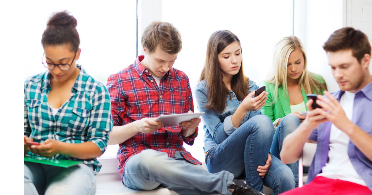 Students using smart devices. Students using smart devices.