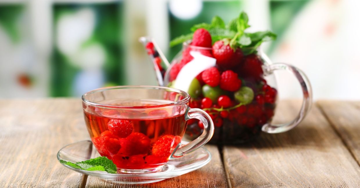 A cup of tea with berries. A cup of tea with berries.