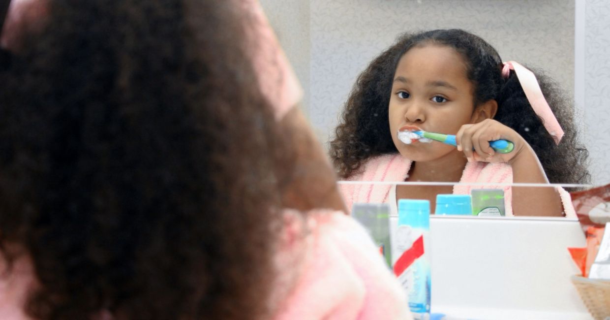 Little girl brushing her teeth. Little girl brushing her teeth.