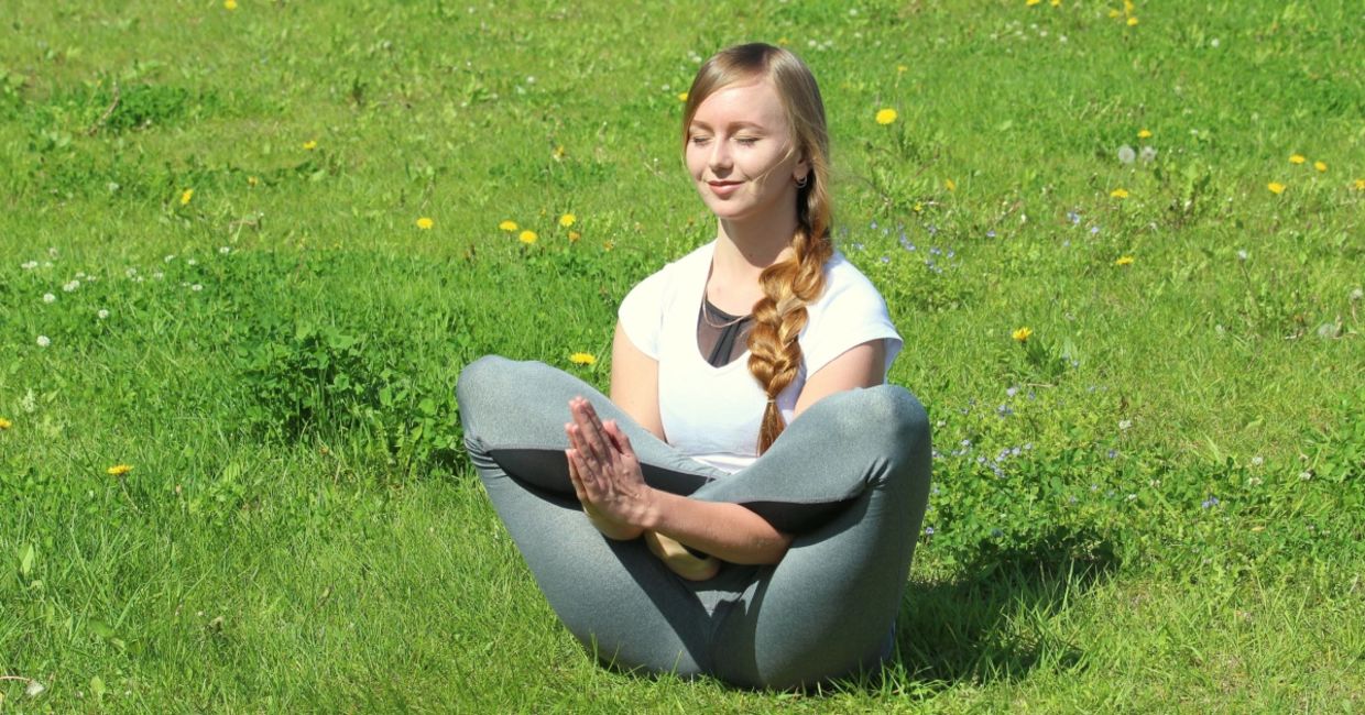 Woman practicing the flower yoga pose. Woman practicing the flower yoga pose.
