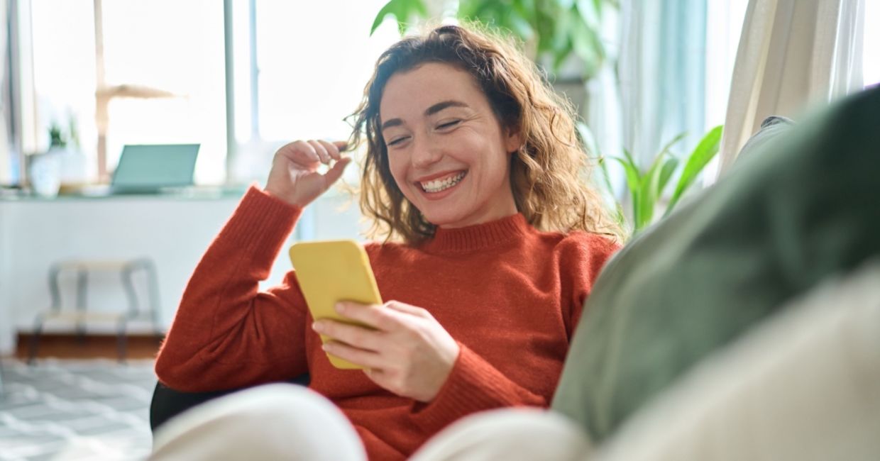 Happy and relaxed young woman working from home. Happy and relaxed young woman working from home.