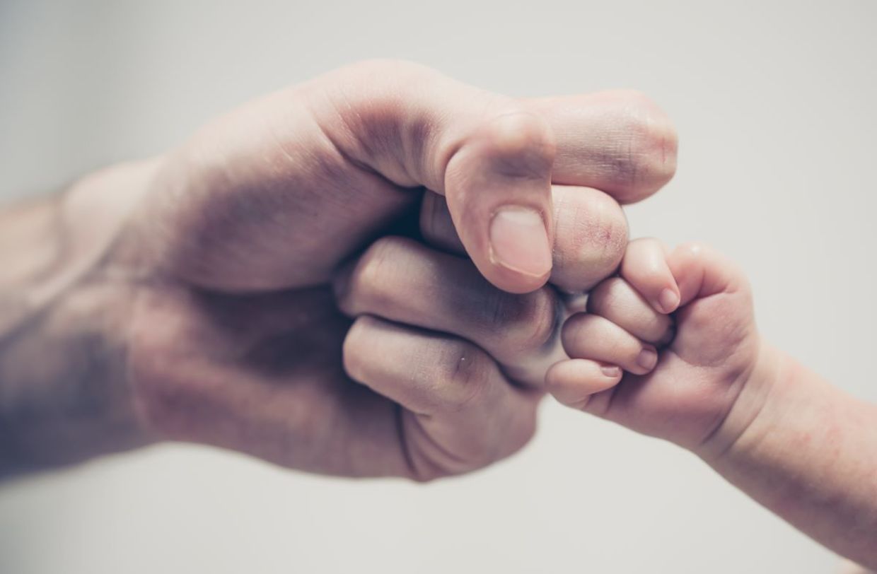 A father with his infant child.