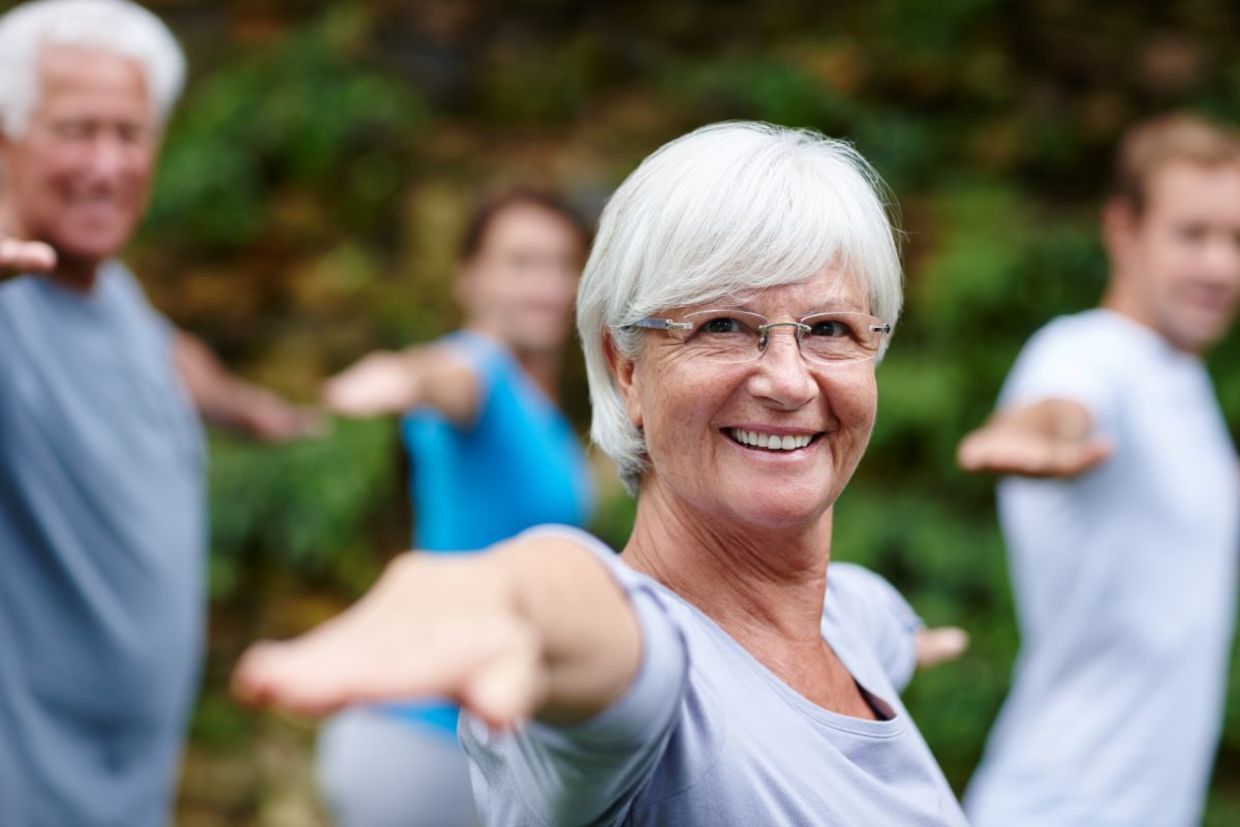 Seniors in a yoga class.