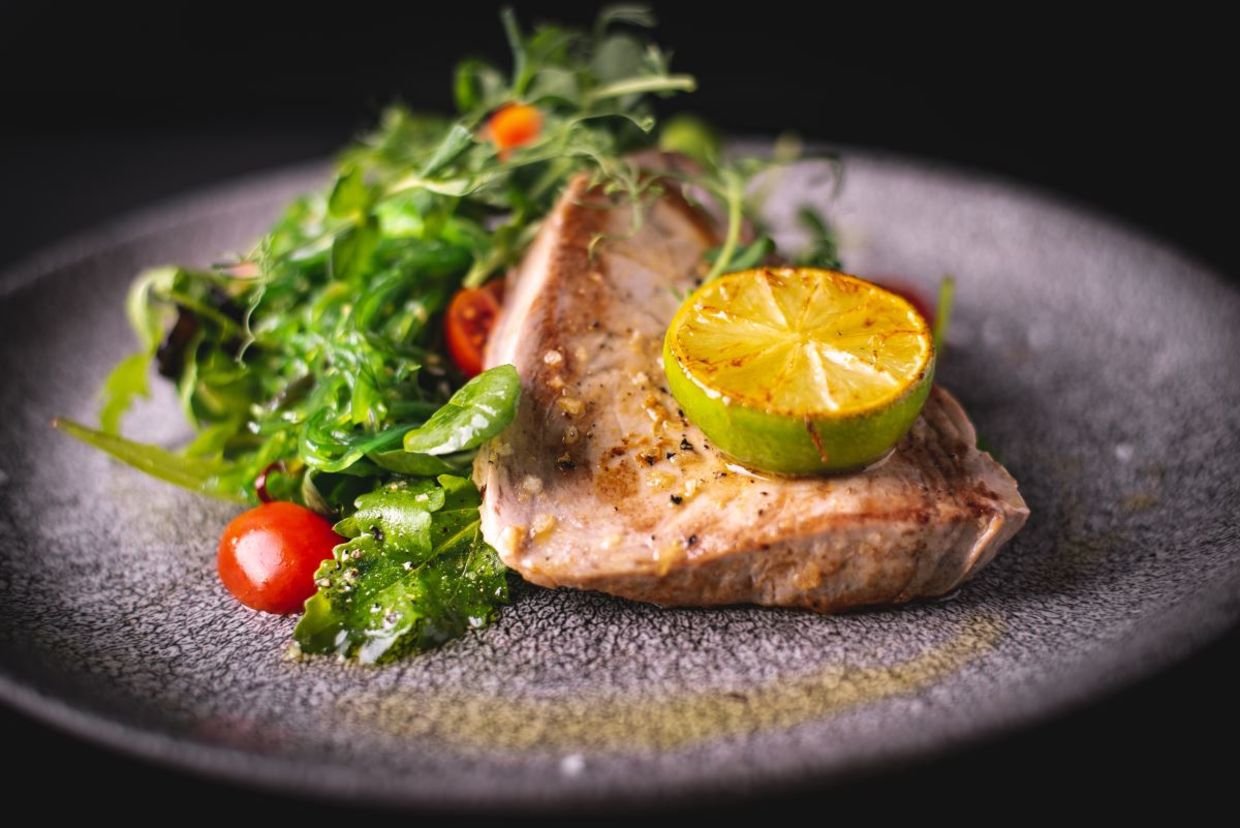Grilled tuna steak with salad. Grilled tuna steak with salad.