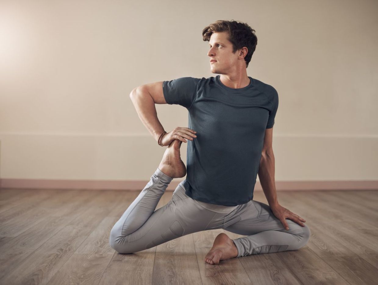Concentrating in the mermaid yoga pose. Concentrating in the mermaid yoga pose.