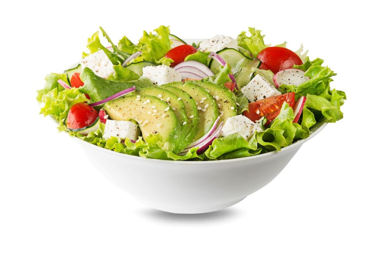 Green salad with cucumbers and avocado. Green salad with cucumbers and avocado.