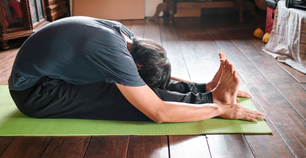 Relax in the seated forward bend yoga pose. Relax in the seated forward bend yoga pose.