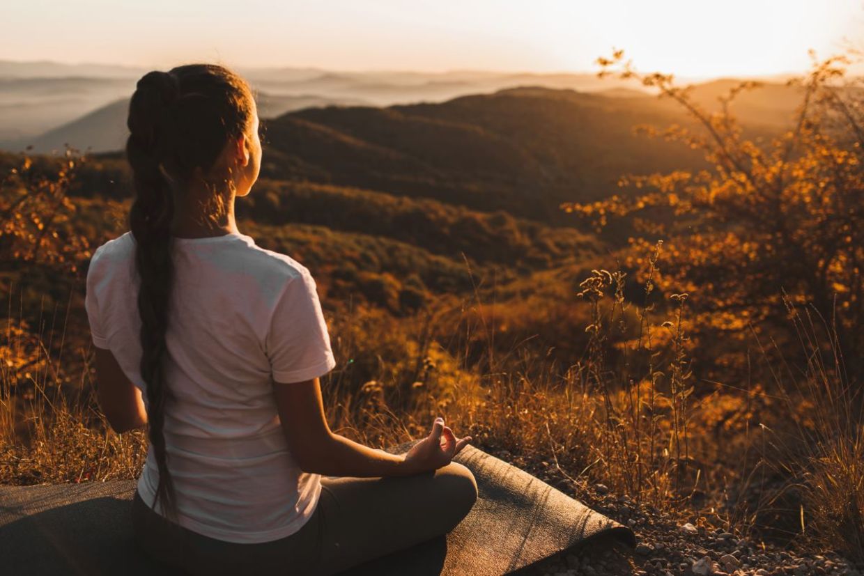 Woman meditating in nature. Woman meditating in nature.