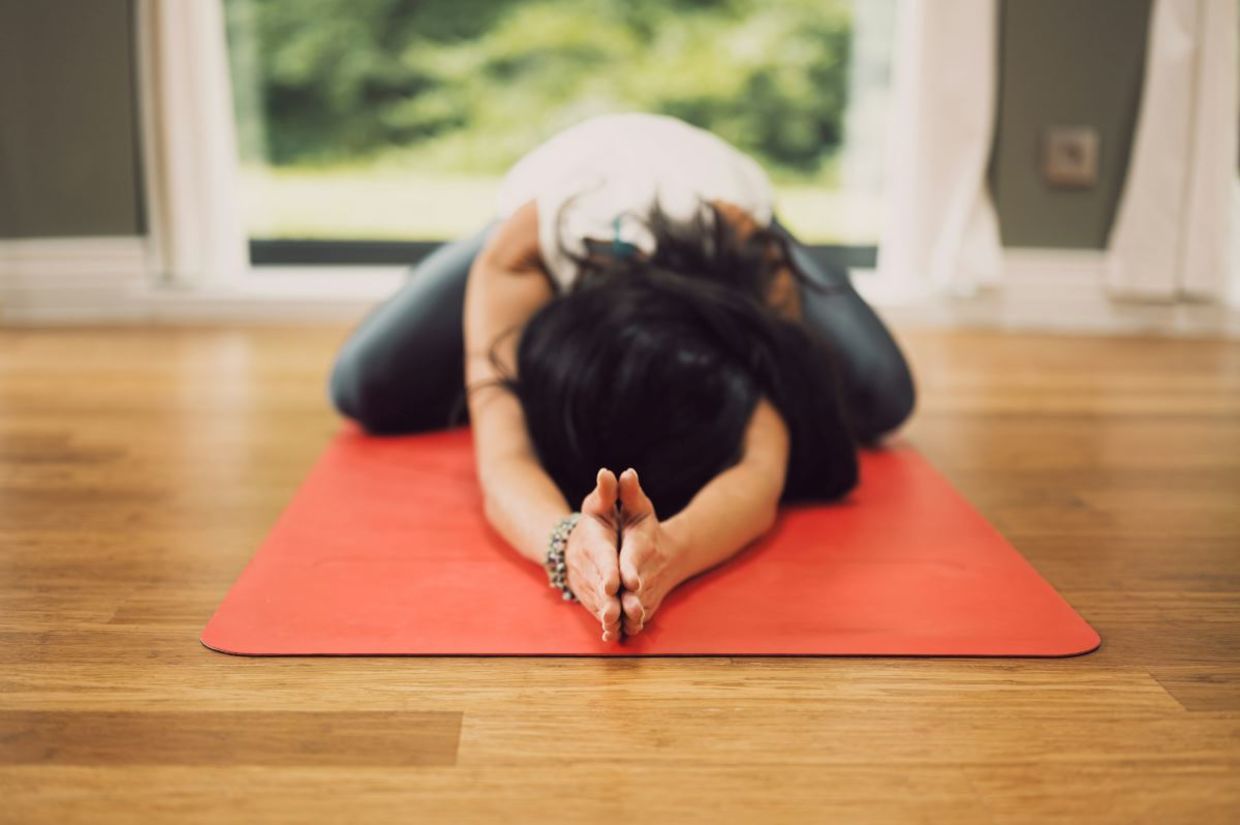 Woman in the child's yoga pose. Woman in the child's yoga pose.