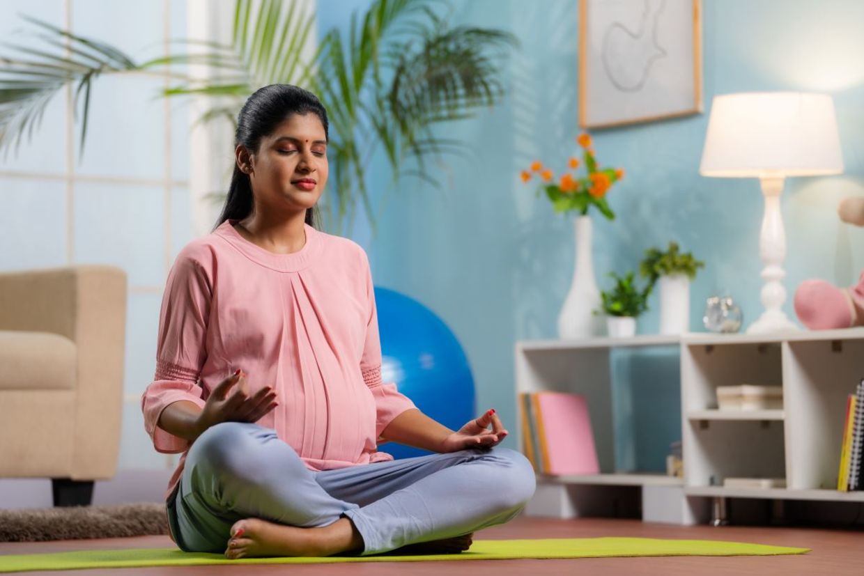 Modify the lotus pose during pregnancy. Modify the lotus pose during pregnancy.
