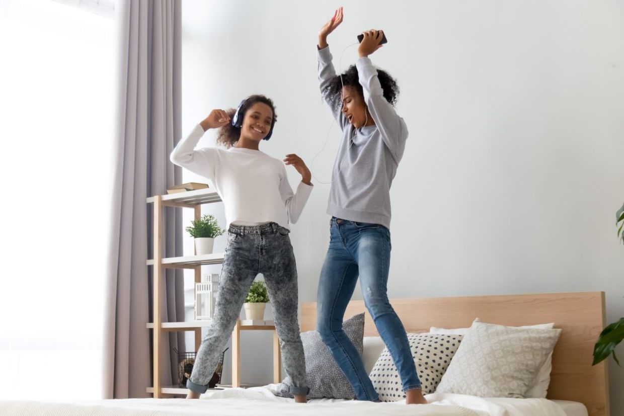Mother and daughter dancing to golden oldies. Mother and daughter dancing to golden oldies.