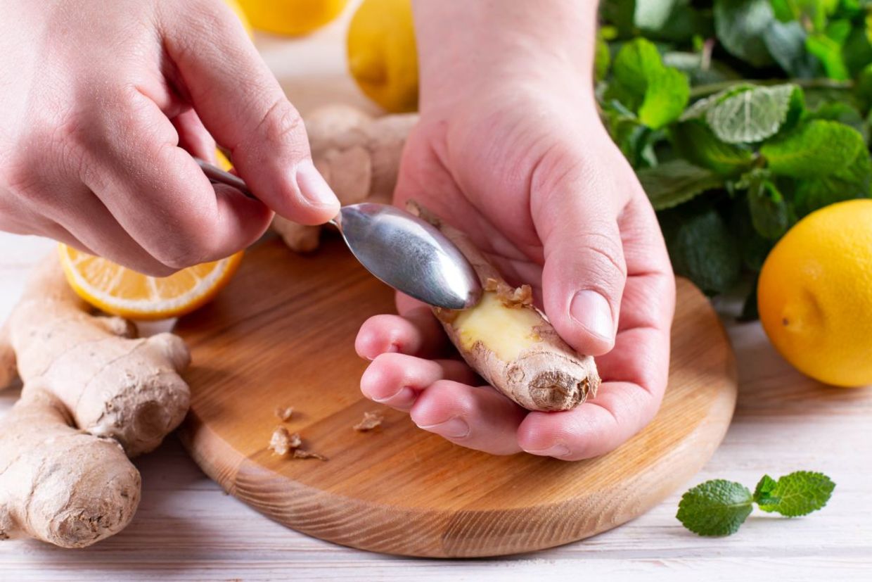 Peeling ginger roots.