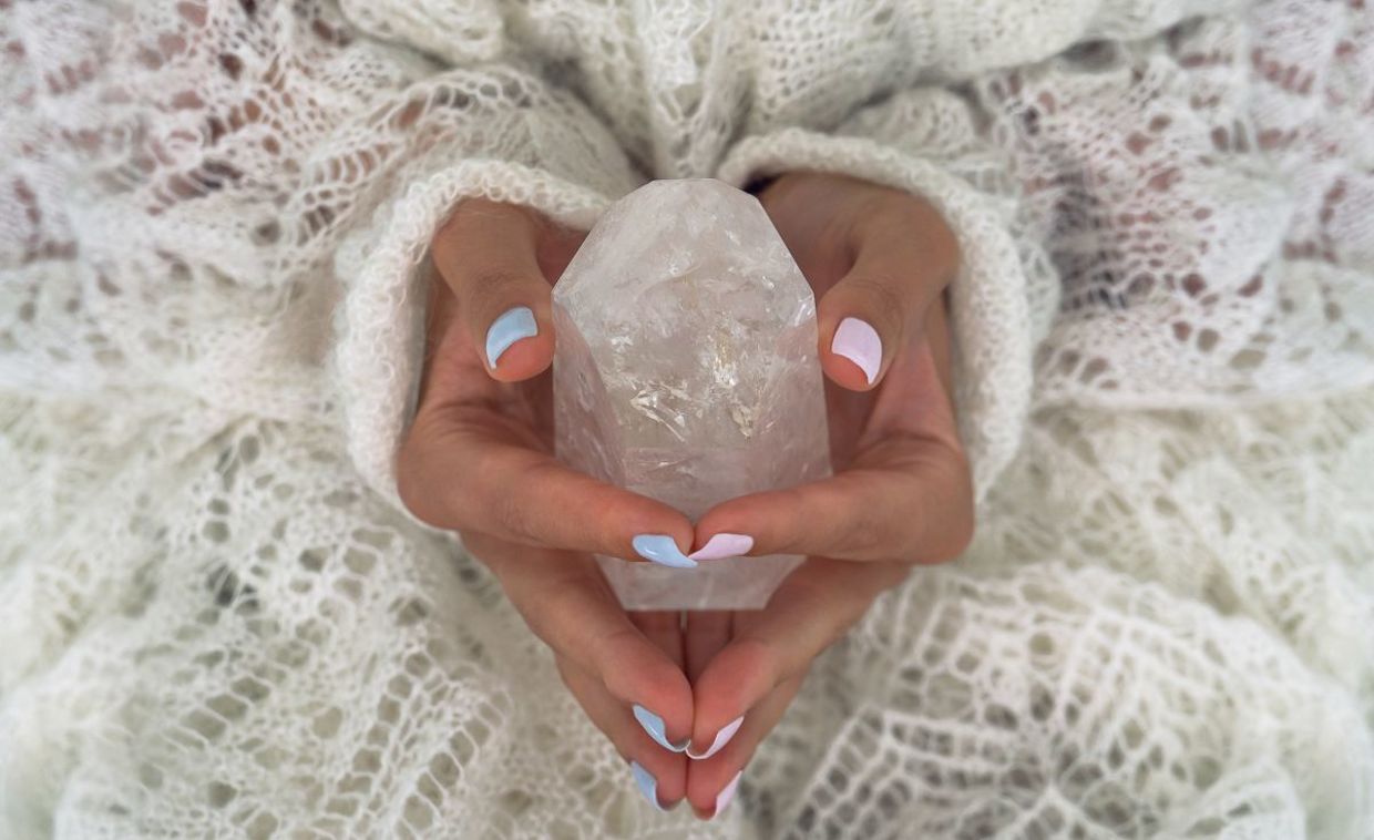 Meditating with a healing crystal.