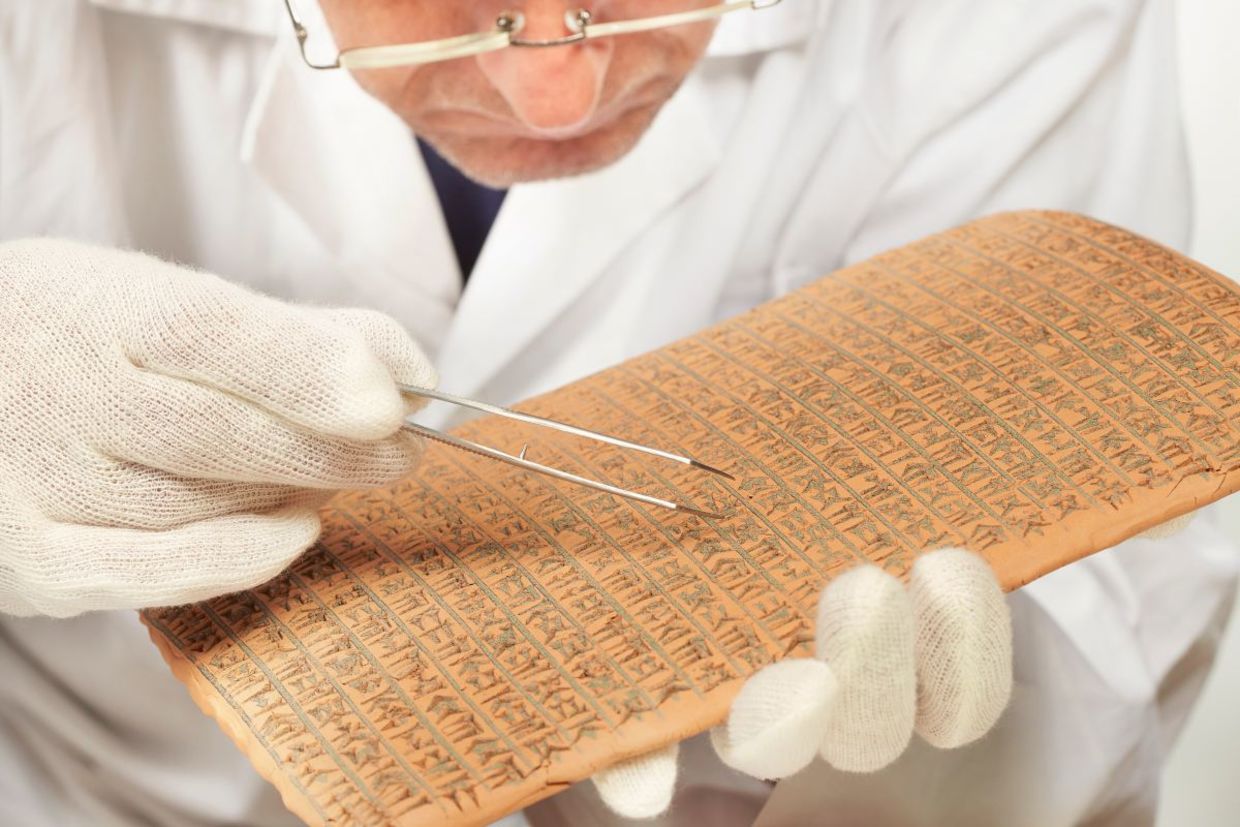 Scientist exploring ancient cuneiform.