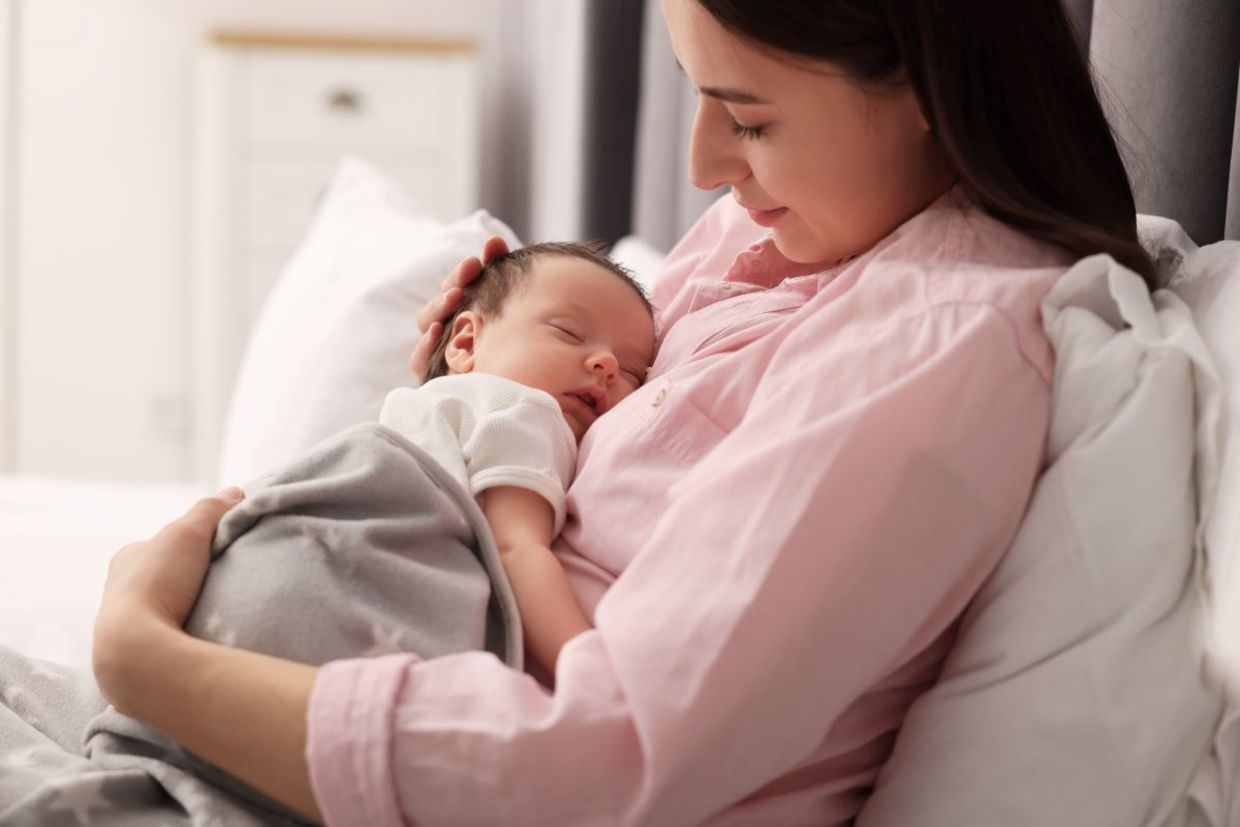 A mother and her newborn. A mother and her newborn.