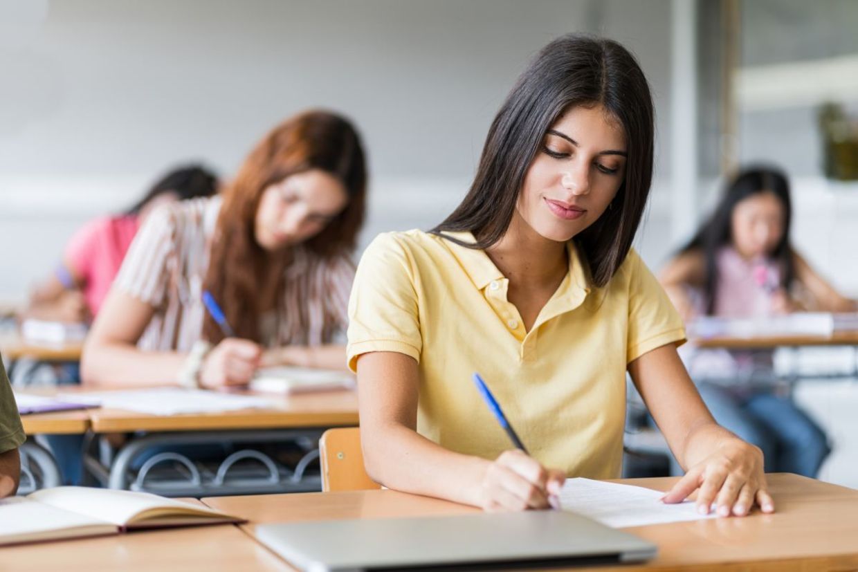 Teens in classroom.